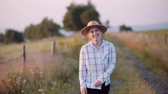 Portrait of Positive Female Farmer at Agriculture Farm