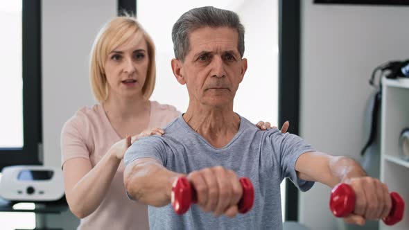 Caucasian senior man working with therapist. Shot with RED helium camera in 8K.