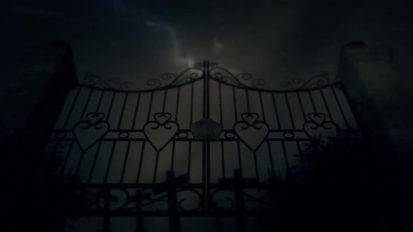 Spooky Old Metal Cemetery Gate Under A Lightning Storm And Rain With Graves