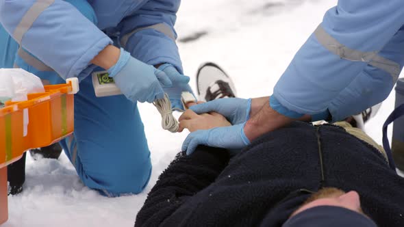 Paramedics Putting Pulse Oximeter on Patient