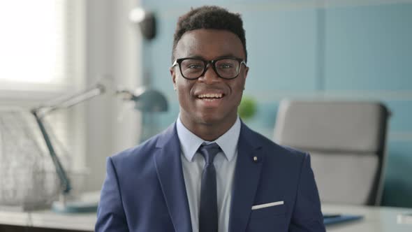 Portrait of African Businessman Talking on Online Video Call