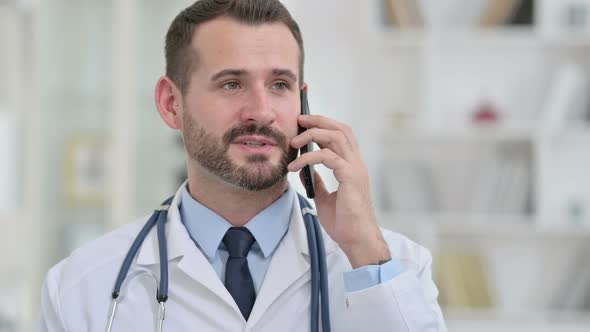 Portrait of Doctor Talking on Smartphone