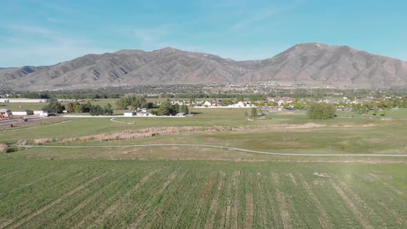 Aerial View of Utah Fields with Mountains in the Background with Blue Sky