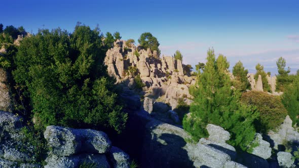 Majestic Scenery with Rock Formations and Coniferous Trees on a Summer Day