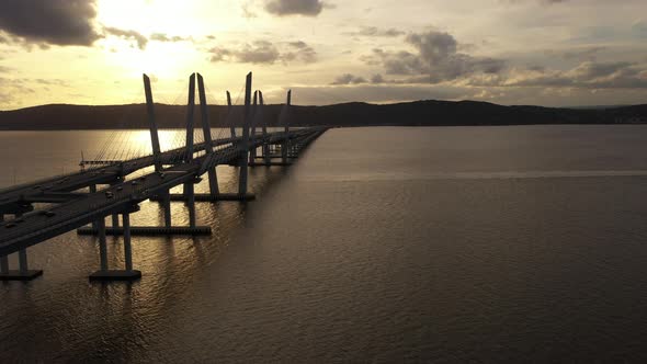 An aerial shot along the length of the Mario M. Cuomo Bridge on the north side. The drone camera dol