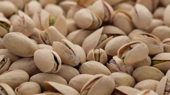 salt pistachios nuts close up. Pistachio nuts in the peel. Whole nut kernels