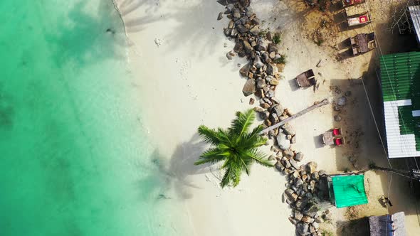 Beautiful above abstract view of a white sand paradise beach and aqua blue ocean background