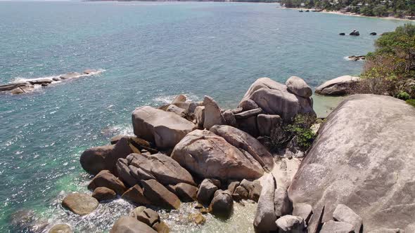 Beautiful 4K drone footage of the beach and unique rock features at Hin Ta Hin Yai Beach on Koh Samu