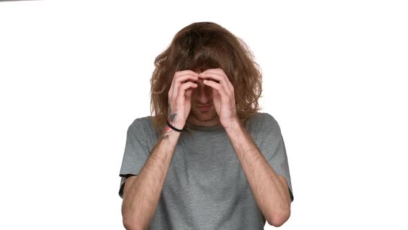 Portrait of Hairy Unshaved Man 20s Shaking His Head with Long Brown Hair with Smile in Slow Motion