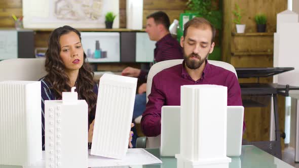 Young Team of Architects Working on Laptop for Buildings Projects