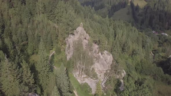 Stone rocks Ternoshorska Lada amidst beautiful scenic Carpathian forests, Ukraine