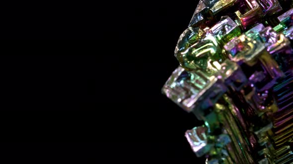 Amazing Colorful Rainbow Bismuth Gemstone Macro Closeup Isolated on Black Background.