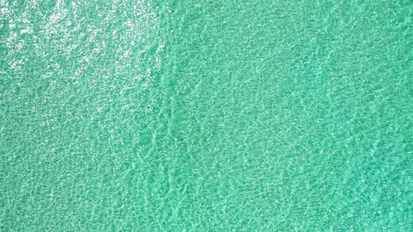 Aerial flying over travel of paradise lagoon beach adventure by blue ocean and white sandy backgroun