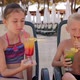 Portrait of Cheerful Children Near the Pool with Bright Rainbow Cocktails - VideoHive Item for Sale