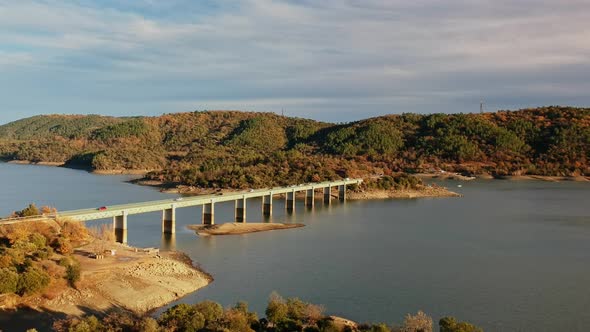 Pre-Claou girder bridge of the lake of Saint-Cassien during the drought in France seen from the sky alt