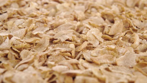 Heap of cereal spelt flakes. Macro view