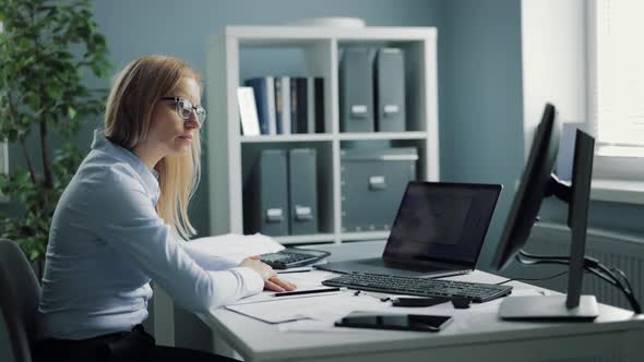 Exhausted Female Manager at Workplace