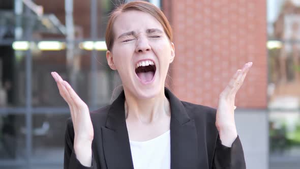 Angry Young Businesswoman Screaming Outdoor