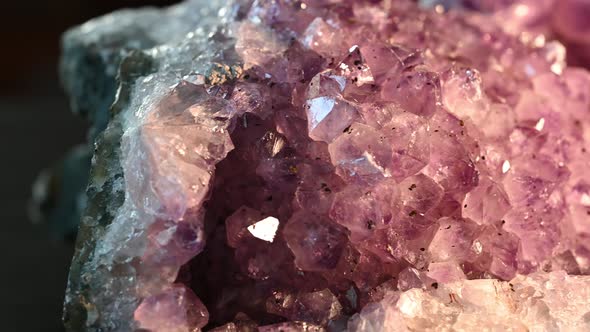 macro view of impurities in an amethyst.  Slow beautiful glimmer as the stone is shown by slider