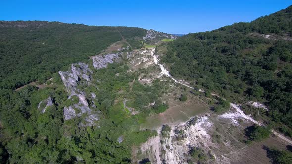 This is an aerial recording of a rocky forest or mountain in Spain, Castilla y León.