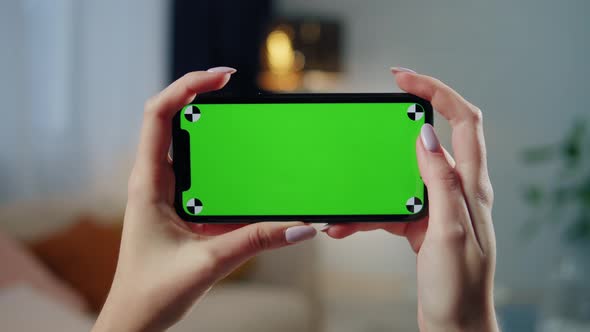 Woman Using Smartphone with Chroma Key Closeup