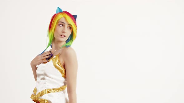 European Girl with Colorful Hair Turning Around and Flirting Medium Studio Shot White Background
