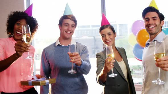 Businesspeople showing glasses of champagne