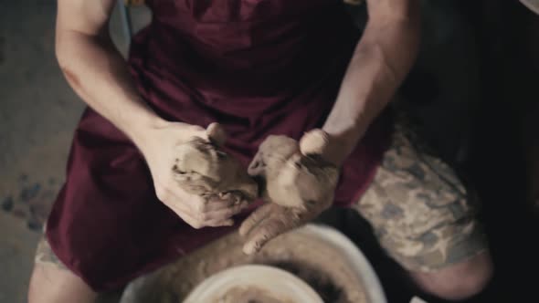 Serious Woman Working at Pottery Wheel in Studio Prepare Clay to Make Plate to Restaurant