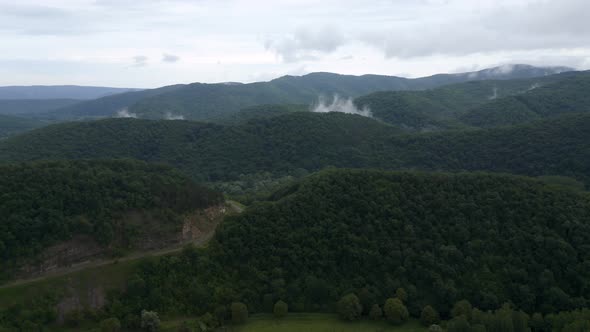 Drone flight over green mountain slopes