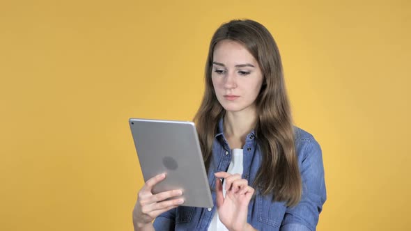 Pretty Woman Browsing Internet Using Tablet