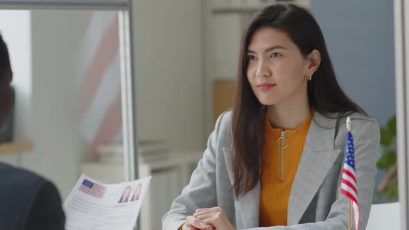 Asian Woman Having Visa Interview in U.S. Embassy