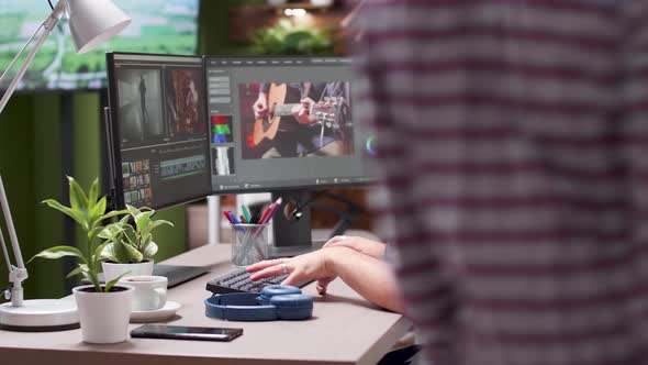 Videographer Working in Busy Office