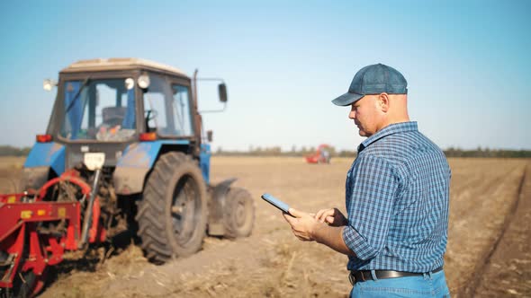 Farmer is Using Digital Tablet