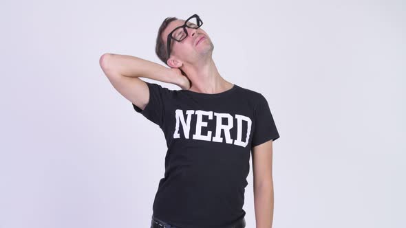 Studio Shot of Stressed Nerd Man Having Neck Pain