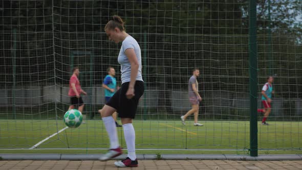 Portrait of Woman Football Soccer Player in Full Growth Woman in Professional Uniform Juggling with