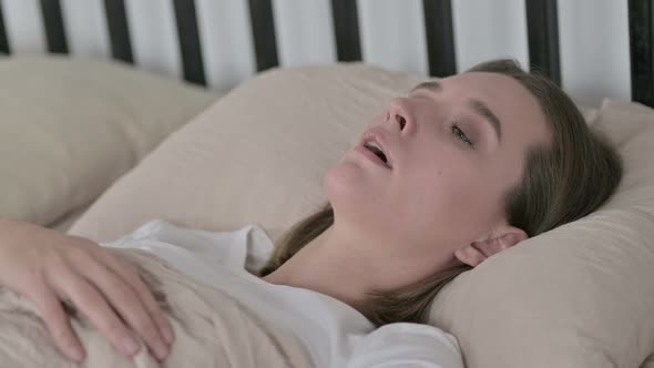 Sick Young Woman Having Coughing in Bed