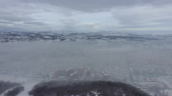 Air polluted from car exhaust and  household heating 4K drone video