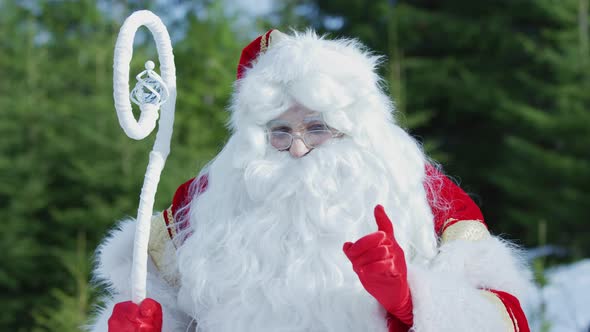 Close up of Santa Claus beckoning with his hand