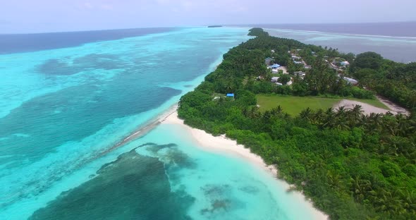 Daytime flying island view of a paradise sunny white sand beach and aqua blue water background in colourful