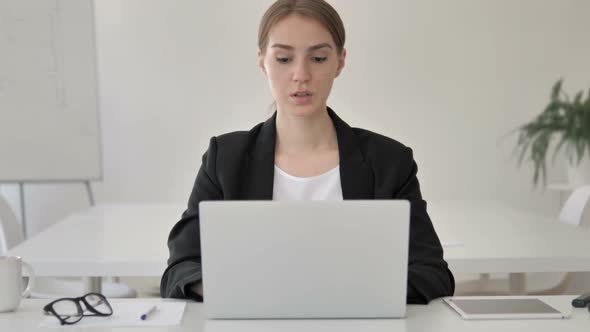 Young Businesswoman Working on Laptop