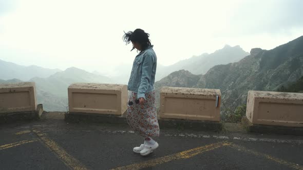 Beautiful Tourist Woman Looking to Mountains Panorama View From Observation Point on Tenerife Island