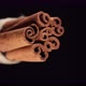 Cinnamon sticks on black background. Vertical video. 4K UHD video - VideoHive Item for Sale