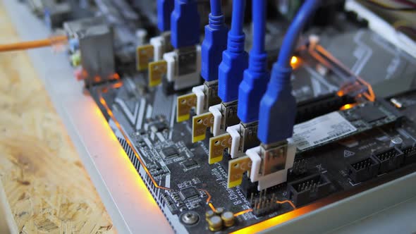 Closeup Cryptocurrency Mining Rig PCIe Riser Extenders Plugged to Motherboard