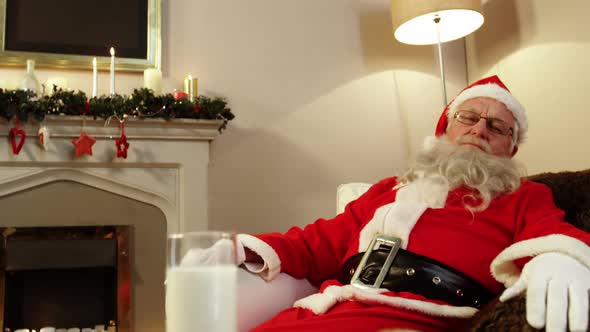 Santa claus relaxing and sleeping