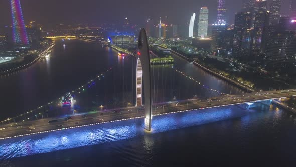 Liede Bridge on Pearl River and Guangzhou Cityscape at Night. China. Aerial View