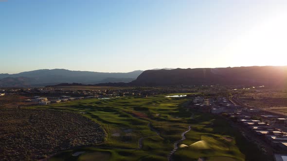 Aerial jib drone flying over the cliff over the sunset. Sunset view of the Ledges golf course in St.