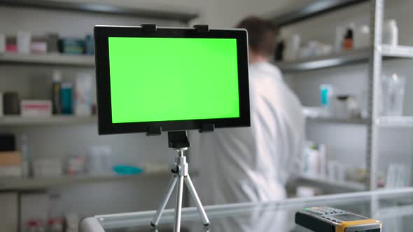 Green Screen Tablet PC Indoor of Pharmacy with Pharmacist Checking Goods