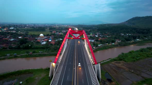 Aerial view of the Kalikuto Bridge, an Iconic Red Bridge at Trans Java Toll Road