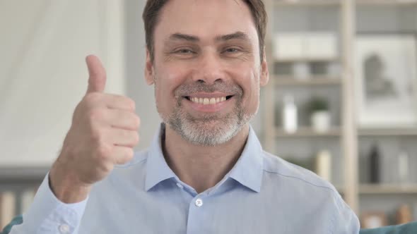 Thumbs Up By Senior Aged Businessman