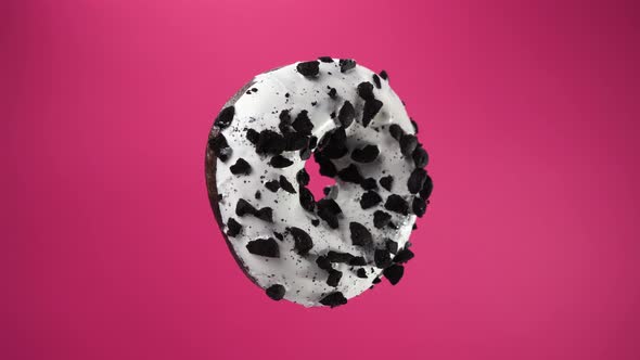 Isolated Donut Rotates on Pink Background. A Beautiful Footage of Sweets for Children and Adults